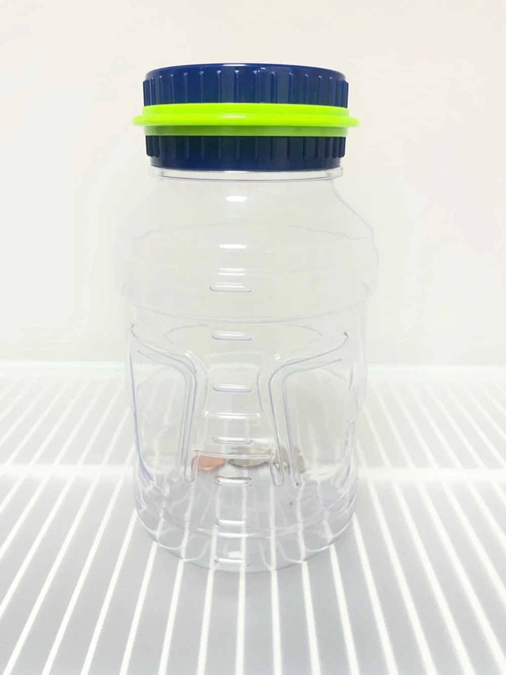 Discovery Kids Clear Coin Counting Money Jar with Blue and Green Lid NWT
